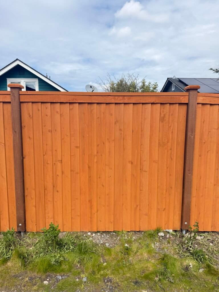 Cedar privacy fence panel with top trim and capped posts